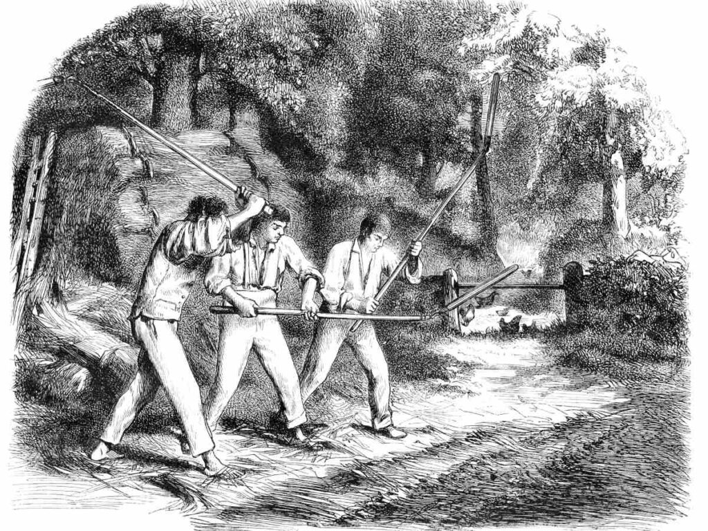 Old black and white engraving of three men threshing wheat outdoors