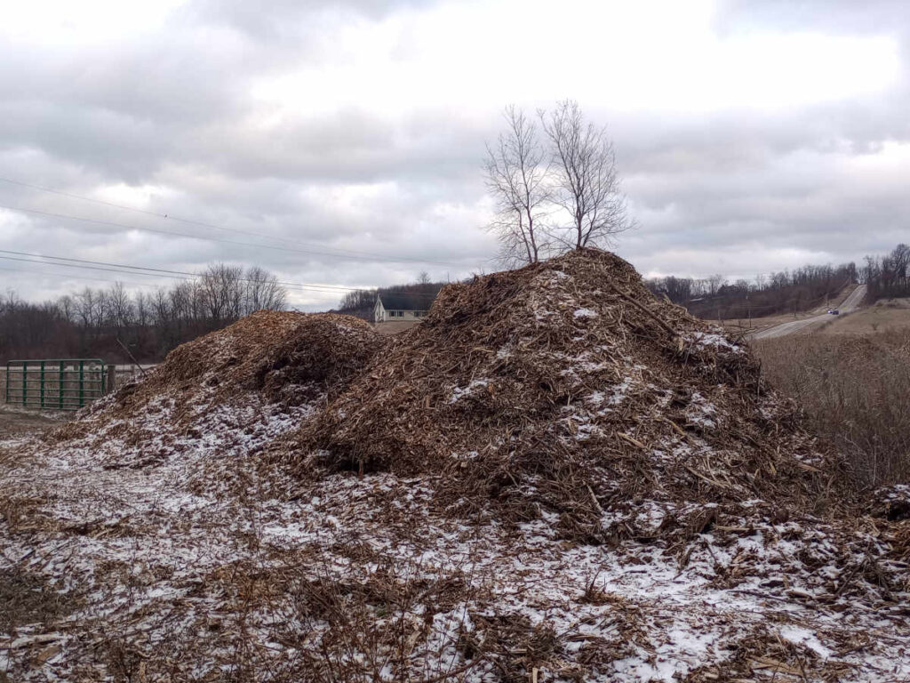 Large mountain of wood chips outdoors