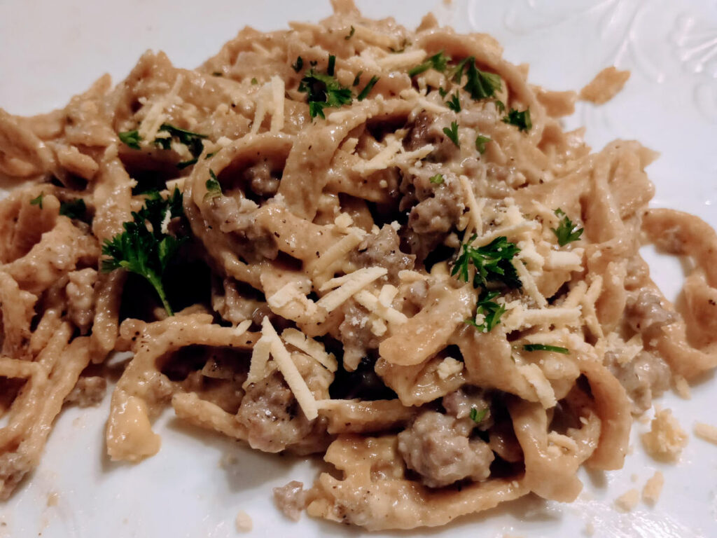 Fettucine with sausage, cheese, and parsley